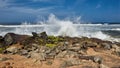 Waves pounding rocks on a beach