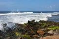 Waves pounding rocks on a beach