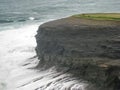 Waves receding from the battered cliffs, Ireland