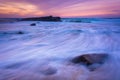 Waves and rocks in the Pacific Ocean at sunset Royalty Free Stock Photo