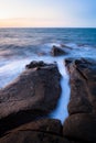 Waves and rocks shore long exposure