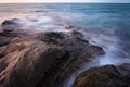 Waves and rocks shore long exposure