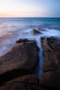 Waves and rocks shore long exposure