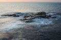 Waves and rocks shore long exposure Royalty Free Stock Photo