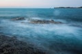 Waves and rocks shore long exposure Royalty Free Stock Photo