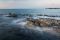 Waves and rocks shore long exposure Royalty Free Stock Photo