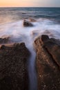 Waves and rocks shore long exposure