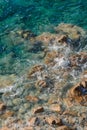 Waves on rocky beach, sea shore with waves crushing over the big rocks Royalty Free Stock Photo