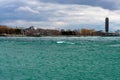 Waves on the Saint Clair river in Port Huron Michigan with buildings in the background