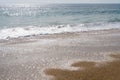 Waves and sand on sunny day in Algarrobo beach Royalty Free Stock Photo