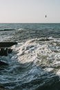 The waves crash on the old pier. Beautiful seascape. Sea spray. Royalty Free Stock Photo