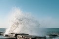 The waves crash on the old pier. Beautiful seascape. Sea spray. Royalty Free Stock Photo