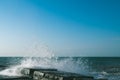 The waves crash on the old pier. seascape. Marine background. Sea spray. Royalty Free Stock Photo