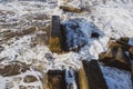 The waves crash on the old pier. Beautiful seascape. Marine background. Royalty Free Stock Photo