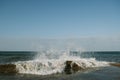 Waves crash on the pier. Sea spray. Royalty Free Stock Photo