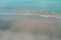 Sandy beach and blue waves. Seascape. Marine background.