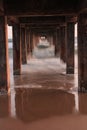 Waves sea and beach under the bridge Royalty Free Stock Photo