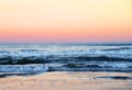 Waves at sea on dramatic sunset background. Waves at sea during storm and wind.