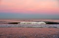 Waves at sea on dramatic sunset background. Waves at sea during storm and wind.