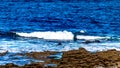 Waves in the sea with limestone at Doolin Bay Royalty Free Stock Photo