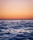 Waves on the sea surface and sky as a background. Seascape during sunset. Nature composition.