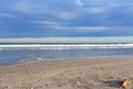 Waves at sea. Waves at sea during storm and wind. Wave from the sea goes on land to the beach.