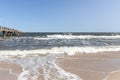 The waves in the seaside resort of Zinnowitz on the island of Usedom surround the great pier Royalty Free Stock Photo