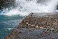 Waves slamming into the rocky coast line in Folegandros