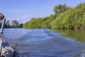 Waves from a small wooden motor boat while searching for a drowned man Royalty Free Stock Photo