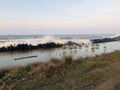 The roar of the waves on the beach