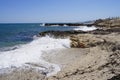 Waves splash against rocks on Anissaras beach Royalty Free Stock Photo