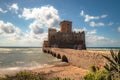 Waves splash at the beach castle Torre Astura, Rome, Italy