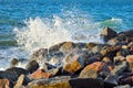 Waves splash on the large boulders on the beach Royalty Free Stock Photo