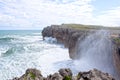 Waves splashing against the rocks of a cliff in Pria Royalty Free Stock Photo