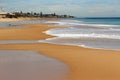 Waves splashing on basalt rocks at Ocean beach Bunbury Western Australia