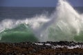 Waves splashing on basalt rocks at Ocean beach Bunbury Western Australia Royalty Free Stock Photo