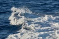 Waves with foam splasing in sea water Royalty Free Stock Photo