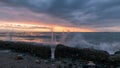 Waves splashing on Whidbey Island during winter storm at sunset Royalty Free Stock Photo