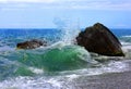 Waves, stone and sea foam