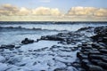 Waves at sunrise at the famous Giant's Causeway Royalty Free Stock Photo