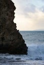 Waves sweeping against the rocks and the beach