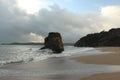 Waves sweeping against the rocks and sand of Carlyon bay in South Cornwall