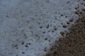 Waves sweeping against the rocks and sand of Carlyon bay in South Cornwall