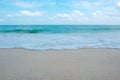 Waves on tropical white beach with blue sky Royalty Free Stock Photo