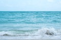 Waves on tropical white beach with blue sky Royalty Free Stock Photo