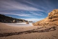 Waves wash onto a small sandy cove near Calvi in Corsica Royalty Free Stock Photo