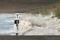 Waves wash over entire beach and up the ramp in Pacific CIty Oregon during storm.