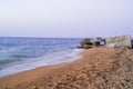 The waves washed ashore with brown sand