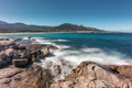 Waves washing onto rocks near Algajola beach in Corsica Royalty Free Stock Photo