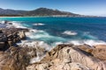 Waves washing onto rocks near Algajola beach in Corsica Royalty Free Stock Photo